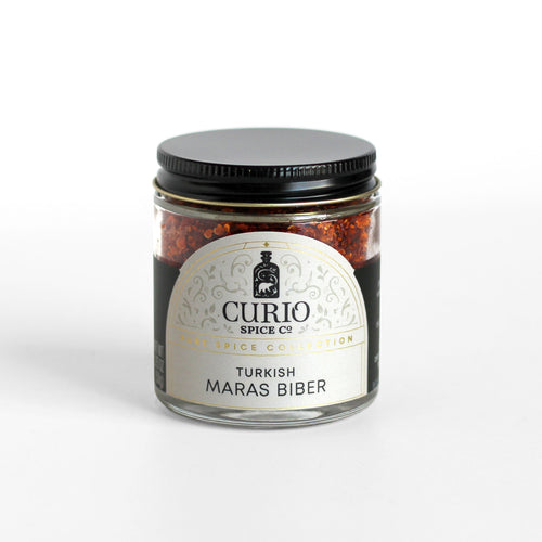 Curio Spice Co. fair-trade single origin sustainable Turkish Maras Biber chile flakes in a glass jar.