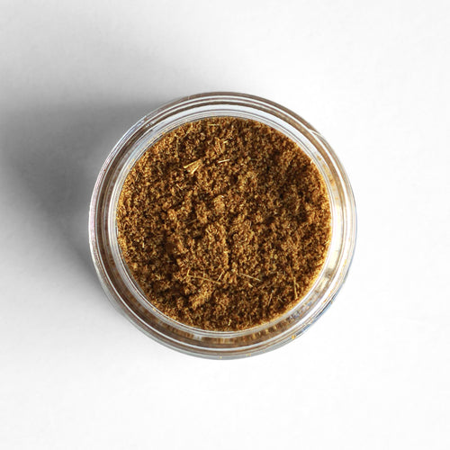 Curio Spice Co. fair-trade single origin sustainable Indian toasted and ground cumin in a glass jar from above.