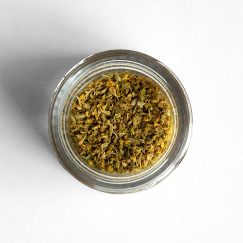 Curio Spice Co. fair-trade single origin sustainable California fennel pollen in a glass jar from above.