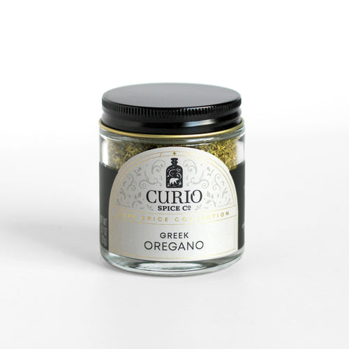 Curio Spice Co. fair-trade single origin sustainable Greek Oregano in a glass jar.