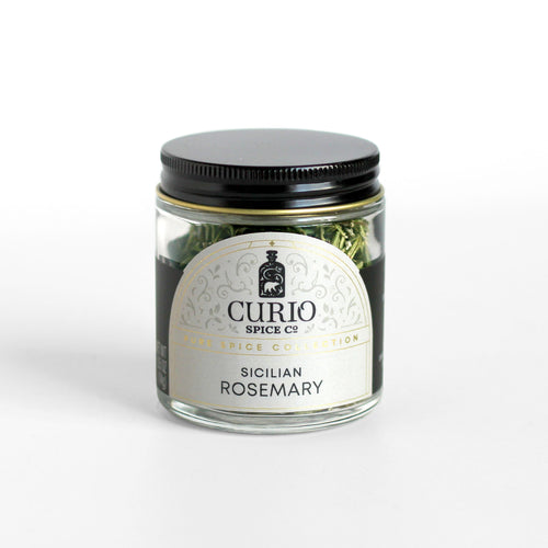 Curio Spice Co. fair-trade single origin sustainable Sicilian Rosemary in a glass jar.