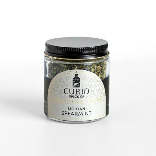 Curio Spice Co. fair-trade single origin sustainable Sicilian Spearmint in a glass jar.