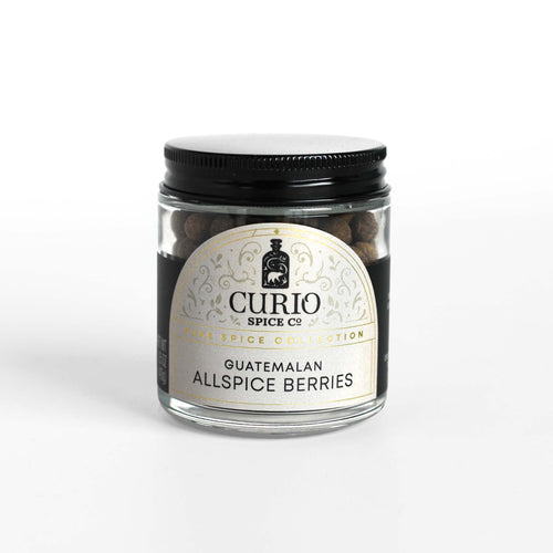 Curio Spice Co. fair-trade single origin sustainable Guatemalan Allspice Berries in a glass jar.