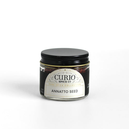 Curio Spice Co. fair-trade single origin sustainable annatto seeds in a glass jar.