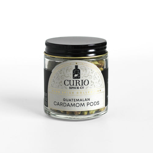 Curio Spice Co. fair-trade single origin sustainable Guatemalan green cardamom pods in a glass jar.