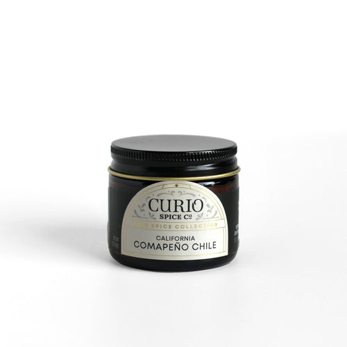 Curio Spice Co. fair-trade single origin sustainable California Comapeno Chile in a glass jar.