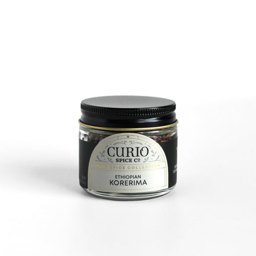 Curio Spice Co. fair-trade single origin sustainable Ethiopian Korerima Grains of Paradise in a glass jar.