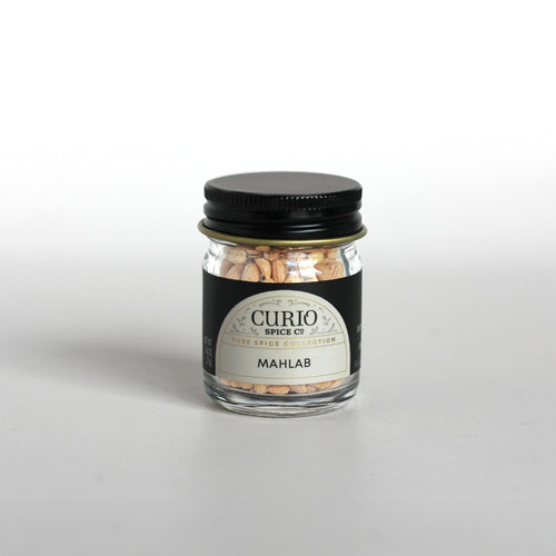 Curio Spice Co. fair-trade single origin sustainable mahlab kernels in a glass jar.