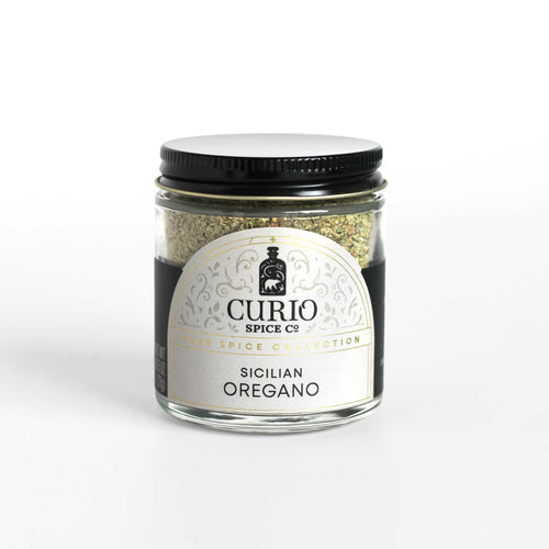 Curio Spice Co. fair-trade single origin sustainable Sicilian Oregano in a glass jar.