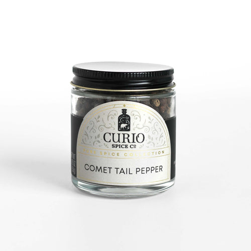 Curio Spice Co. Comet Tail Pepper Cubeb in a glass jar.