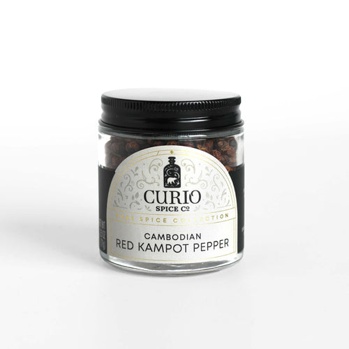 Curio Spice Co. fair-trade single origin sustainable Cambodian Red Kampot Pepper in a glass jar.