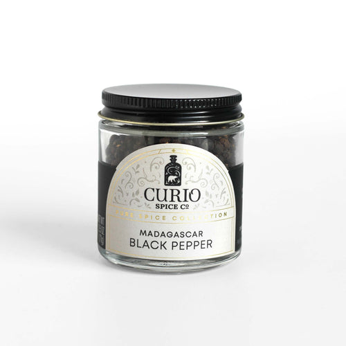 Curio Spice Co. fair-trade single origin sustainable Madagascar Black Pepper in a glass jar.