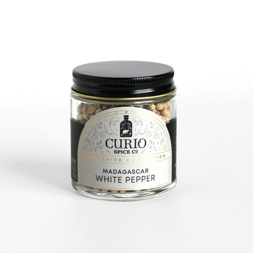 Curio Spice Co. fair-trade single origin sustainable Madagascar White Pepper in a glass jar.