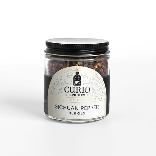 Curio Spice Co. Sichuan Pepper Berries in a glass jar. 