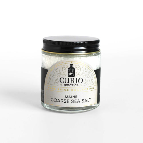 Curio Spice Co. fair-trade single origin sustainable Maine Coarse Sea Salt in a glass jar.