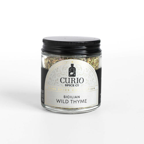 Curio Spice Co. fair-trade single origin sustainable Sicilian Wild Thyme in a glass jar.